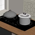 Sleek Black Induction Cooktop with Silver Pots on Wooden Kitchen Counter