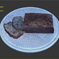 Freshly Baked Banana Bread with Slices on White Ceramic Plate