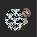 Round Rug with Black and White Floral Pattern Teal Accents Pink Armchair in Cozy Corner