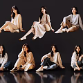 Group of Women in Casual Outfits With Different Sitting Poses on Dark Background