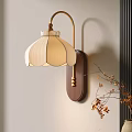 Elegant Wall Lamp with White Pleated Shade Brass Arm Wooden Base on Beige Wall