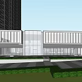 Modern Commercial Street Entrance With Glass Facade Buildings And Central Fountain Area