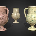 Green Decorative Plants in Colorful Speckled Vases with Handles on Black Background