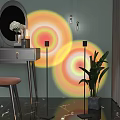 Modern Floor Lamp Projecting Colorful Light Circles in Bedroom Vanity Area with Green Plant