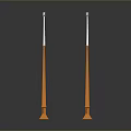 Two Orange Candles With White Wicks And Bases On Black Background