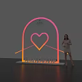 Woman Posing Next to Romantic Arch Landmark With Heart Neon Light