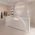 Chilichan Women's Fashion Store With White Counter Hanging Clothes And Shelves