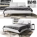 Modern White Upholstered Double Bed With Gray Bedding And Geometric Rug