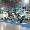 Exhibition Booth Setup Featuring CRYPTTO Sign More To Explore And Motorcycles