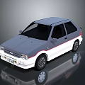 Vintage Gray And White Hatchback Car With Sleek Front Design And Sporty Wheels
