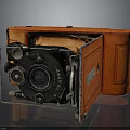 Vintage Camera With Orange Leather Case Black Lens And Folding Design