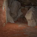 Natural Cave Interior With Rough Stone Walls Large Rocks And Sandy Ground
