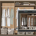 Wooden Wardrobe Interior With Hanging Robes Folded Towels And Storage Baskets
