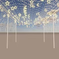 Event Entrance Featuring Star Moon Shaped Lights Blue Sky Background and White Pillars