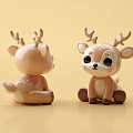 Adorable Brown Deer Stuffed Toys Sitting With Antlers On Yellow Background