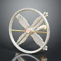 Artisan Decorative Wheel Ornament With Gold Accents Central Pink Stone And Intricate Patterns