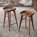 Two Brown Wooden Stools With Modern Design And Natural Wood Finish