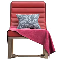Red Lounge Chair with Gray Patterned Pillow and Pink Blanket on Golden Metal Legs