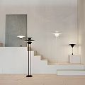 Modern Lighting Combination with White Floor Lamp and Black Table Lamp on White Pedestals