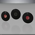 Three Vintage Vinyl Records With Red Labels Central Design On Dark Background