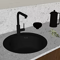 Black Kitchen Sink with Modern Faucet on Light Countertop and Bowl Olive Branch Kettle