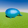 Blue Whale Shaped Garden Ornament On Lush Green Grass Under Clear Blue Sky
