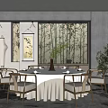 Chinese Style Private Dining Room With Round Table White Tablecloth Bamboo Backdrop And Green Plants