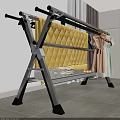Metal Clothes Drying Rack With Yellow Quilt Pink Dress And Green Clothes Indoor