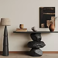 Modern Minimalist Console Table With Stacked Stone Base Books Cup Vase Floor Lamp Wall Painting