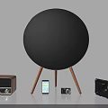 Black Round Speaker with Wooden Legs and Vintage Radio Smartphones Cameras