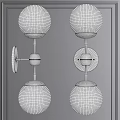 Modern Vintage Brass Wall Sconces With Clear Glass Globes On Gray Wall