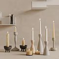 Candle Holders with Lit Candles Various Ceramic Wooden Designs Against Neutral Wall and Shelves
