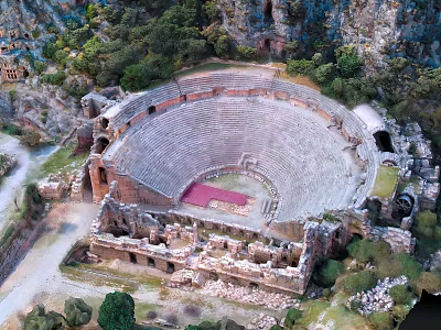 Ancient Circular Theater Ruins Surrounded by Trees and Rocky Archaeological Site 3d model