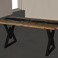 Wooden Dining Table With Dark Resin Strip And Black X Shaped Legs In Minimalist Interior