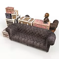 Dark Brown Tufted Sofa With Stacked Suitcases Wooden Boxes And Small Statue