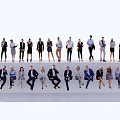 Group of Business People in Formal Attire with Various Standing and Sitting Poses