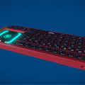 Red Backlit Computer Keyboard With Green Glowing Area and Standard Key Layout