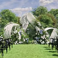 Outdoor Wedding Floral Display with White Blue Blooms Green Foliage and Welcome Sign