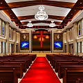 Religious Worship Church Interior With Cross Red Carpet Chandelier Wooden Pews And Stained Glass