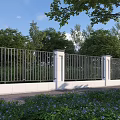 Outdoor Metal Fence With White Pillars Surrounded By Green Trees And Flowers Under Blue Sky