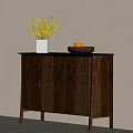 Wooden Sideboard Featuring Black Countertop White Vase Yellow Flowers And Brown Bowl With Yellow Fruits