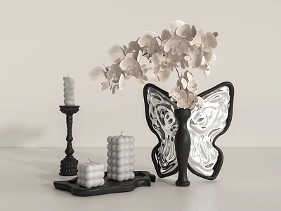 Butterfly Shaped Black Vase With White Flowers And Black Candle Holders On Light Colored Table 3d model