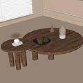 Small and Large Round Wooden Coffee Tables With Pinecones Vases and Book