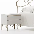 Elegant Double Bed With Curved Metal Headboard White Bedding Dark Blanket And Bedside Tables