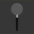 Magnifying Glass With Black Handle And Clear Glass Lens On Gray Surface