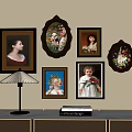 Wall Decor With Various Framed Portraits Table Lamp And Books On Cabinet