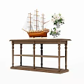 Wooden Coffee Table with Glass Top Featuring Sailing Ship Model and White Flower Vase