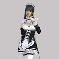 A Woman In Elegant Black And White Maid Costume With Lace Trim And Bow Details