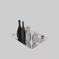 Elegant Wine Bottles And Glasses With Silver Cocktail Shakers On Silver Tray And Olives
