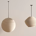 Modern Pendant Lights Featuring Spherical And Layered Paper Shades Against Neutral Backdrop
